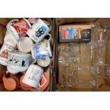 Four boxes of assorted items including china collector's mugs, glasses, storage jars, etc.