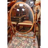 A 20th Century stained wood framed antique style dressing table mirror with oval plate and slender