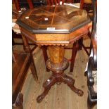 A 17 1/2" Victorian walnut and mahogany trumpet work table with stencilled geometric decoration to