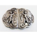 An Anglo Indian white metal nurse's buckle with raised female warrior deity decoration