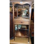 A 13 3/4" late Georgian mahogany three tier bedside stand with central drawer, set on slender square