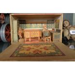 A 1920's Swedish cut-paper and wood doll's house with mother, child, and furniture