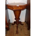 A 17 1/4" Victorian mahogany and figured trumpet work table with remains of interior, set on faceted