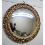 A gilt plaster framed convex wall mirror - sold with a small gilt framed oblong wall mirror