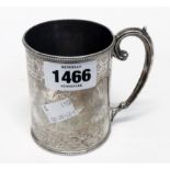 A Victorian silver mug with two bands of engraved decoration and scroll handle - base marks