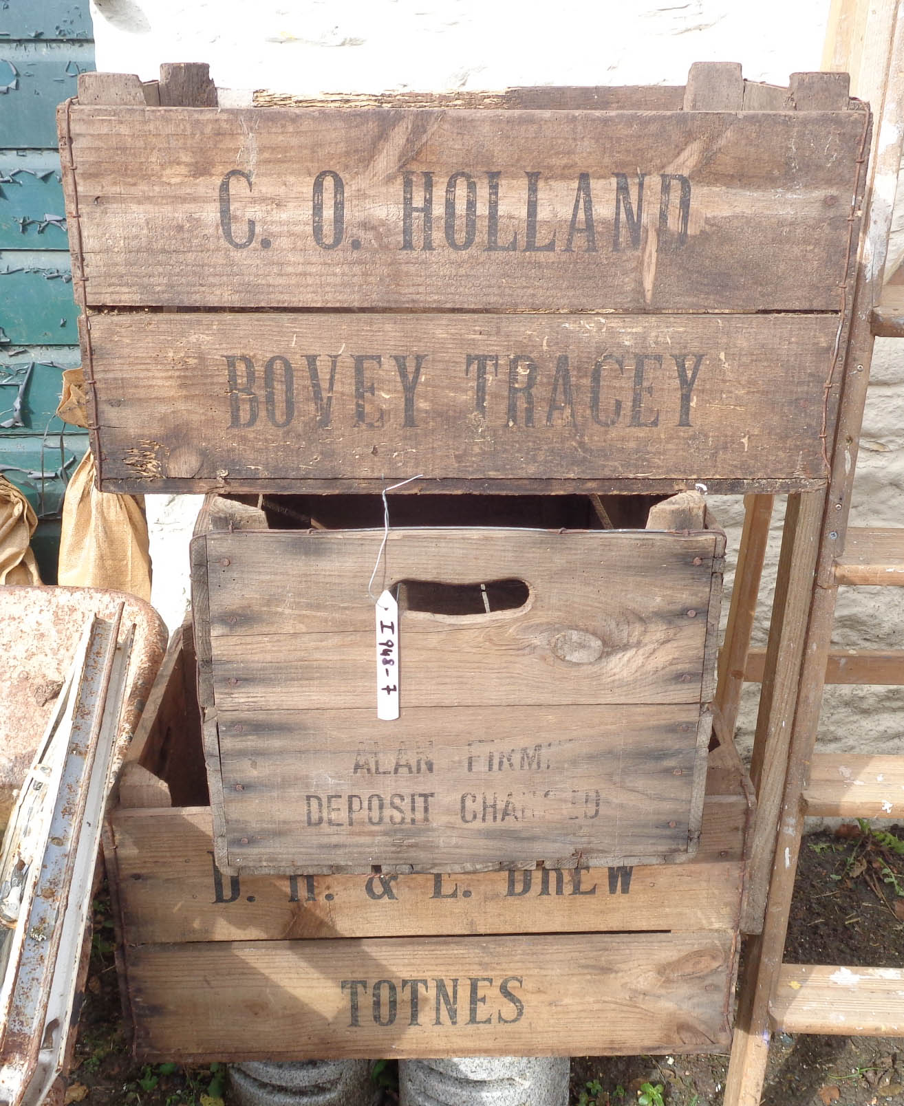 Three branded wooden crates - various condition