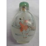 A Chinese glass scent bottle with internal painted decoration with hardstone stopper