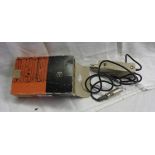 An AKG B46E microphone battery power supply in original box