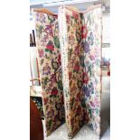 A vintage four fold dressing screen with floral panel upholstery