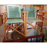 A pair of stained wood and canvas director's style folding chairs