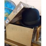 A boxed G.A. Dunn & Co. grey top hat with pair of Veloura gloves - sold with a Gieves black bowler