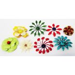 A collection of enamelled and other large flowerhead pattern brooches