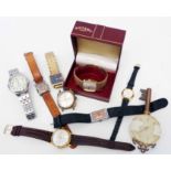 A box containing a collection of assorted wristwatches including boxed Rotary and vintage