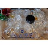 A box containing a large assortment of drinking glasses, vases, coloured decanter, etc.