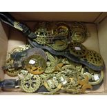 A collection of antique and later horse brasses, some on martingales, two makers brasses for W. P.
