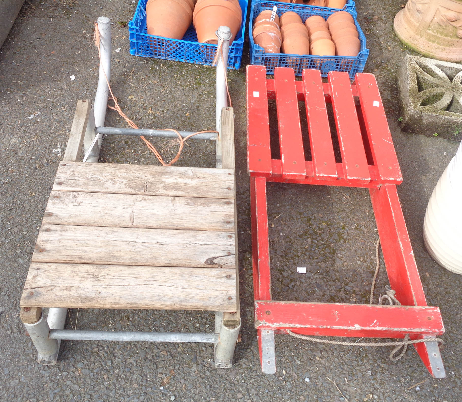 A wooden sledge and another similar - one a/f