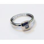 An import marked 375 white gold tiny diamond solitaire ring