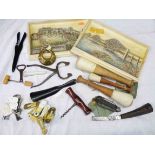 A box containing assorted items including two Osborne Ivorex plaques, corkscrews, penknife, pestles,
