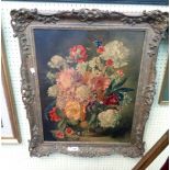 Lionel Ellis: an ornate gilt framed oleograph on canvas, still life with vase of flowers
