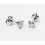 A pair of marked 750 white metal diamond stud ear-rings - 1.3ct. TDW