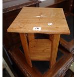 A pair of hardwood two tier bedside tables with compass point inlaid tops and canted corners