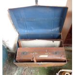 A tin trunk and vintage suitcase