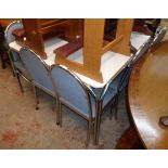 A 4' chrome plated framed dining table with white Formica style top - sold with a set of six hoop