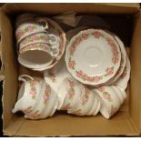A bone china part tea service with pink floral spray decoration