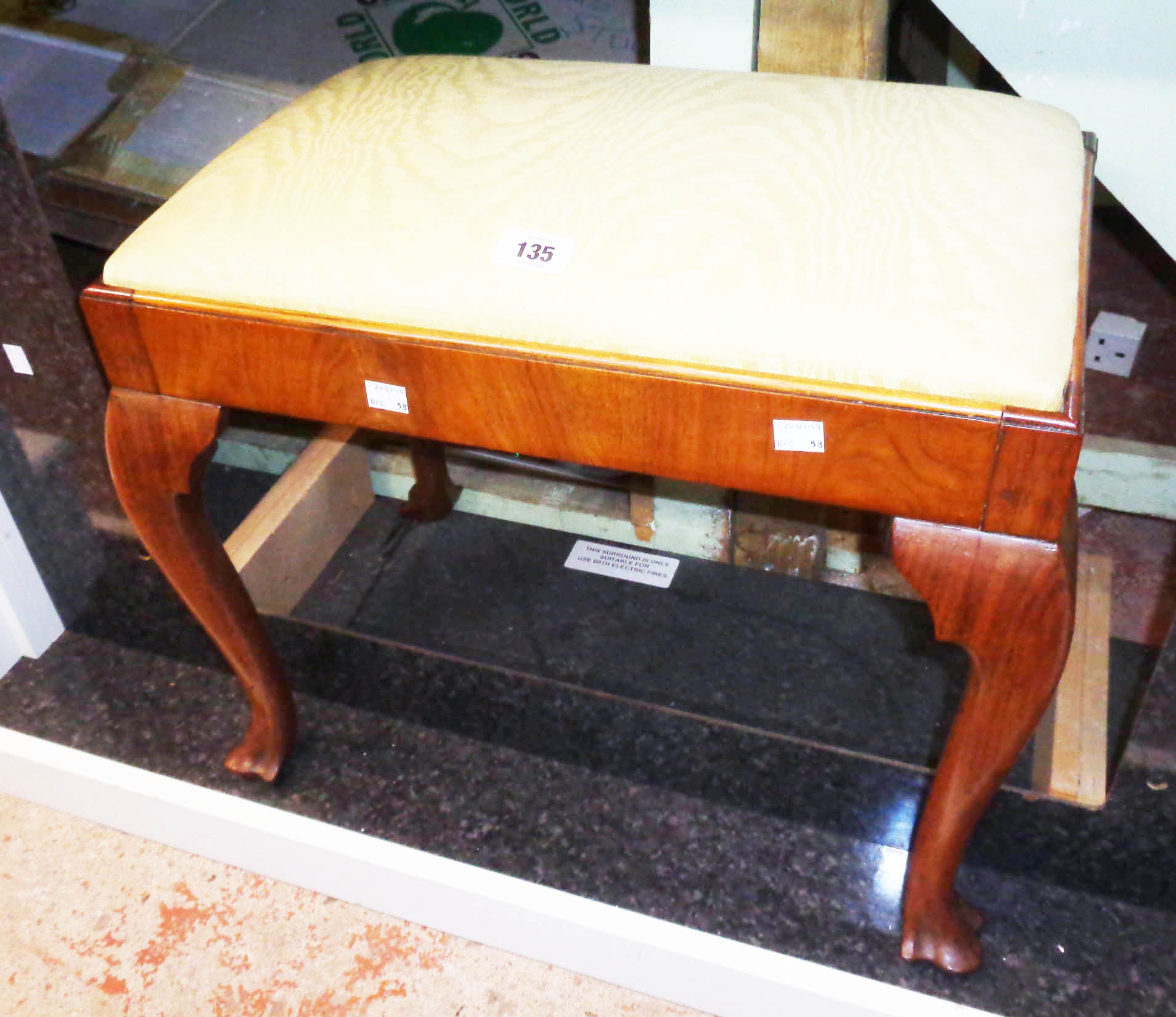 An early 20th Century stained walnut framed dressing stool with upholstered drop-in seat panel,