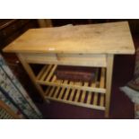 A 3' 3 1/2" modern blonde wood kitchen preparation unit with butcher's block style top, two short