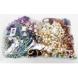 A bag containing a quantity of mainly costume jewellery necklaces