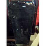 A vintage black japanned metal travelling trunk