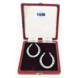 A cased pair of silver horseshoe pattern novelties - Sheffield 1975/81