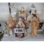 Nine assorted continental porcelain figurines