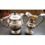 A silver plated hand made bulbous pedestal jug - sold with a hot water jug with flip lid