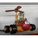 A painted wooden toy Danny Morrell flying car