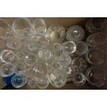 Three boxes containing a quantity of glassware including storage jars, vases, dishes, assorted