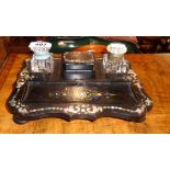A 9" Victorian mother-of-pearl inlaid papier-mâché inkstand with flanking ink wells central nib