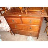 A 3' 1" early 20th Century oak chest of two short and two long graduated drawers, set on square