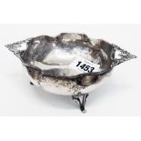 An ornate Continental 830 grade white metal bon-bon dish with a shaped rim and flanking cast