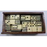A boxed set of Victorian bone nine spot dominoes