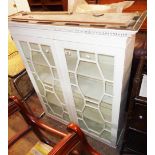 A 3' 3 1/2" later painted antique book cabinet with shelves enclosed by a pair of astragal glazed