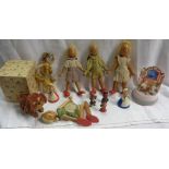 A collection of small vintage toys comprising three Spanish mud dolls, a 1920`s bisque headed