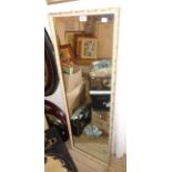 A parcel gilt framed long oblong wall mirror - sold with two similar modern stained wood framed oval