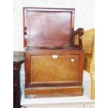 An Edwardian mahogany and strung lift-top box commode with folding armrests