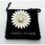 A Georg Jensen daisy flowerhead pattern brooch - marked 925 S - with original pouch