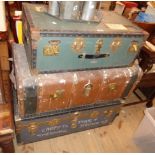 Three vintage travelling trunks comprising two with brassed metal and studded binding, the other