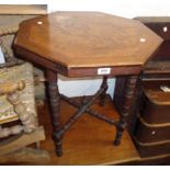 A 22 1/2" Edwardian walnut and strung octagonal topped occasional table, set on turned supports
