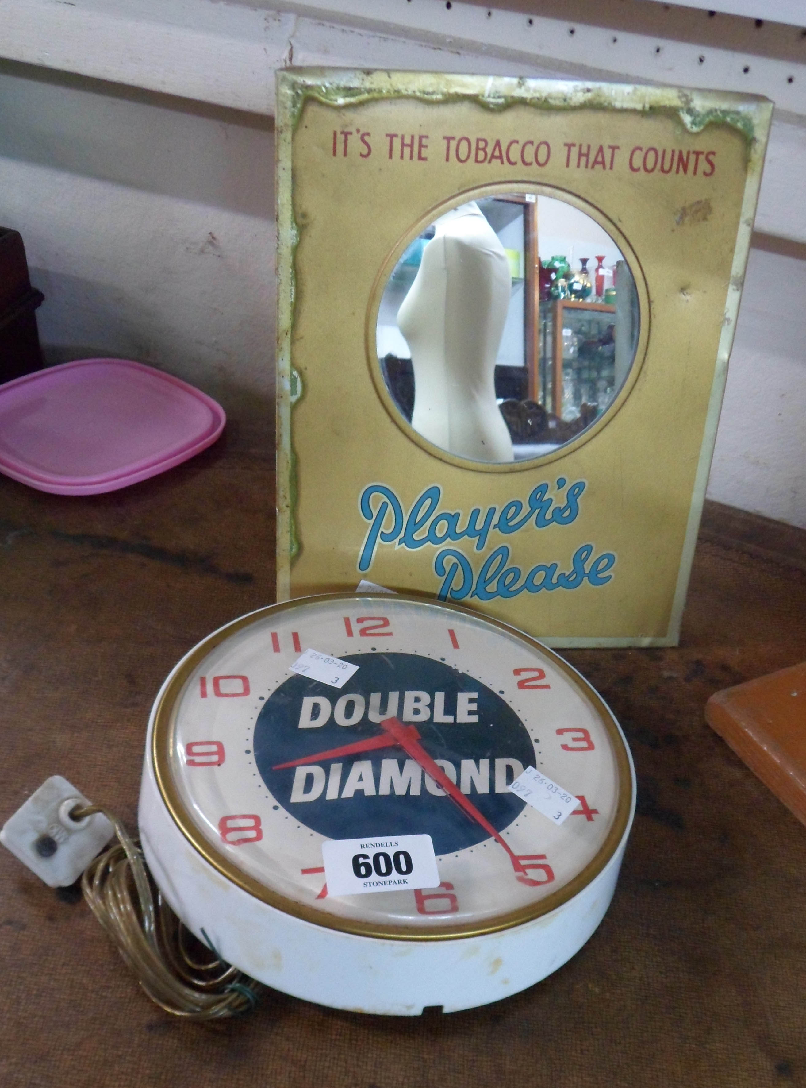 A vintage Double Diamond electric wall clock and a Player's mirror