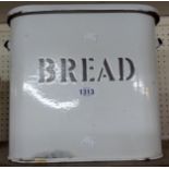 An enamel bread bin